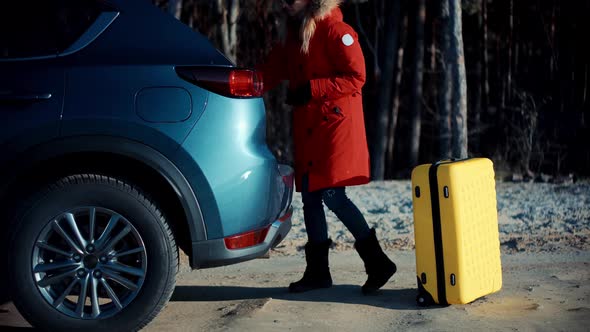 Traveler Transportation With Suitcase. Holiday Vacation Weekend In Winter. Yellow Travel Bag Luggage