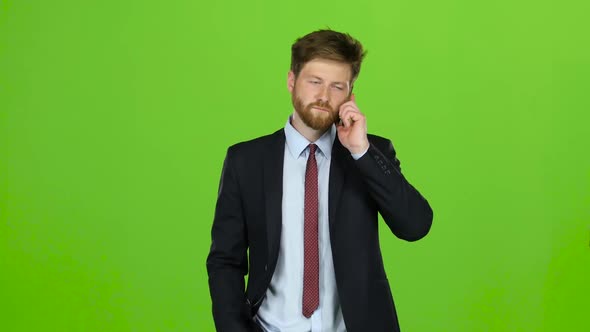 Guy Walks Down the Street, Puts His Hand in His Pocket and Waves. Green Screen