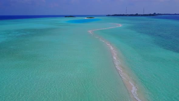 Drone aerial panorama of bay beach by blue water and sand background