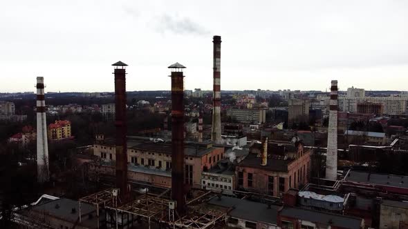 Aerial view of a drone flying over an industrial plant. Plant pipes