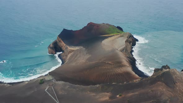 Big Waves Bouncing Against a Rocky Coastline of Capelinhos Volcano Faial Island