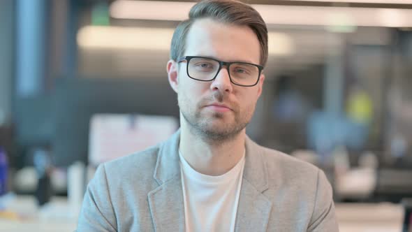 Portrait of Man Looking at Camera