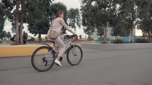 Girl on a Bike in City