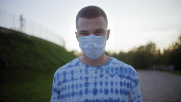 Punk Man Portrait Wearing a Protective Medical Mask Covid Safety Coronavirus Pandemic Millennial Boy