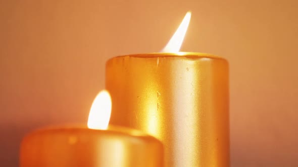 Close-up of candles burning