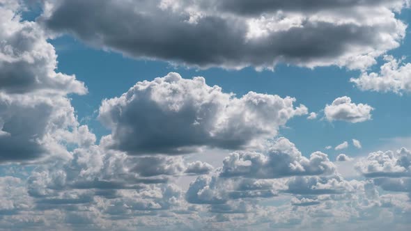 Summer Clouds Float Across the Blue Sky in Shuttles Shape Timelapse