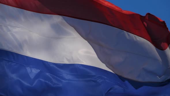 The national dutch flag waving in the wind.