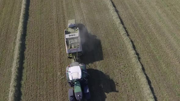 aerial hay bale production rotating view with reveal 4k