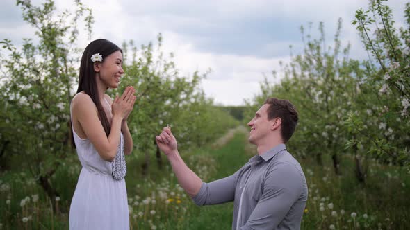 Happy Woman Accepting Marriage Proposal From Man