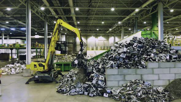 Industrial Machine Is Transporting Waste in a Landfill Unit