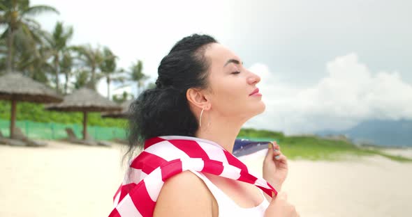 Patriotism Independence Day and Holidays Concept Happy Smiling Young Woman in Swimsuit with National