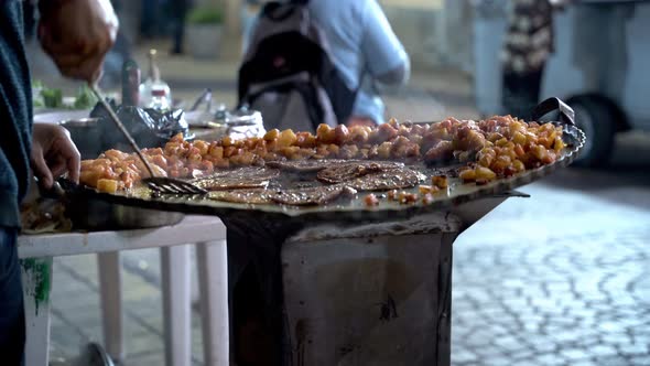 Street food cook cooking some enchiladas