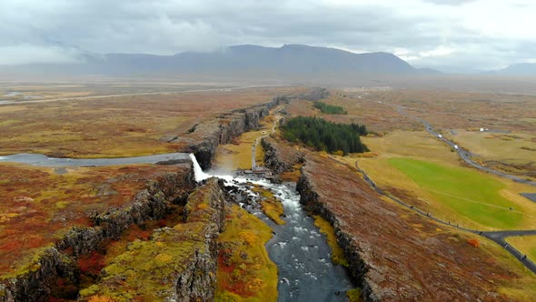 Aerial View Autumn Landscape in Iceland, Rocky Canyon with Waterfall, Thingvellir