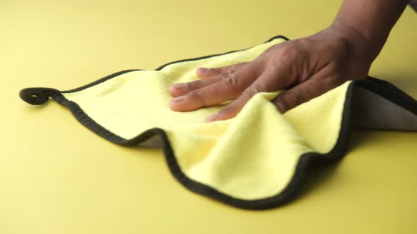 Person Hand Cleaning Table with Cloth