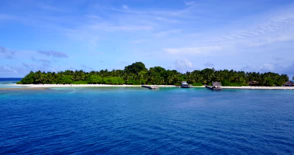 Wide angle aerial clean view of a paradise sunny white sand beach and aqua turquoise water backgroun