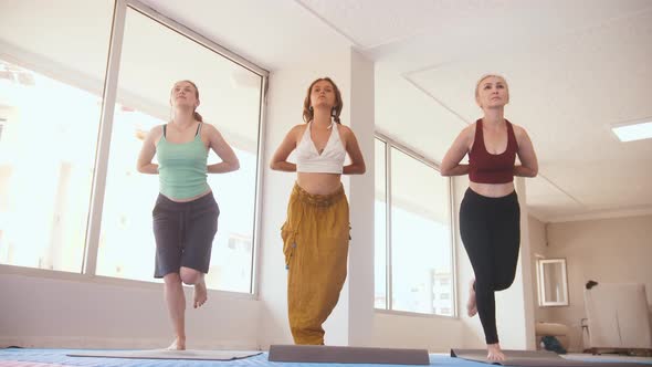 Three Women Having Yoga Classes in the Studio