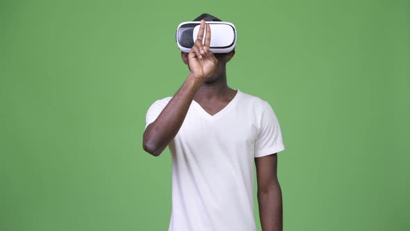 Young African Man Using Virtual Reality Headset