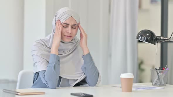 Young Arab Woman Feeling Worried While Thinking in Office