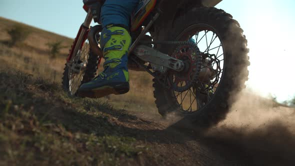 Motorcycle starting off and leaving dust behind