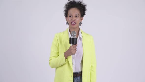 Happy Young Beautiful African Businesswoman As Newscaster Using Microphone