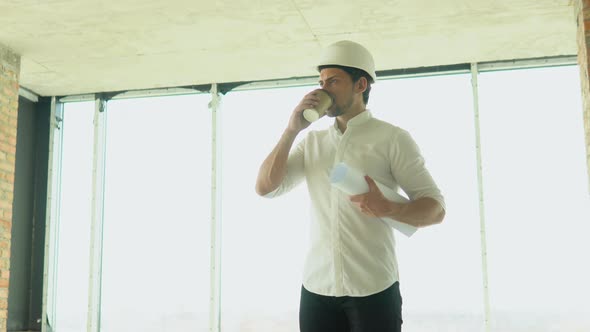 Engineer Builder Architect Drinks Coffee on Civil Engineer Architect Construction Site