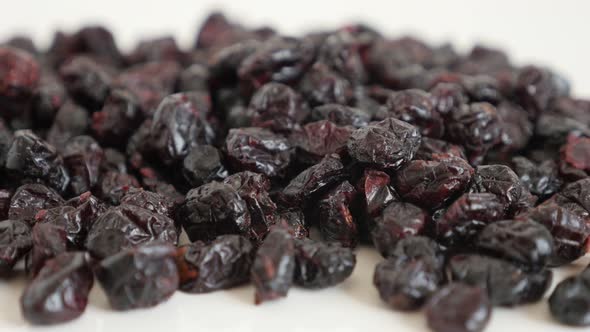 Close-up of dehydrated cranberries on pile 4K 2160p 30fps UltraHD tilting footage - Vaccinium oxycoc