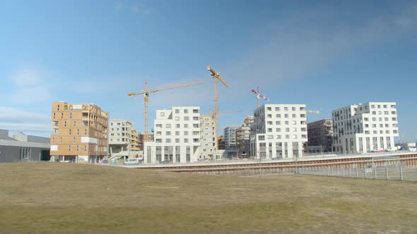 Tower Cranes At The Development Site Constructing Timber And Concrete Buildings In Seestadt Aspern,