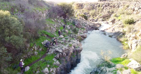 Aerial view of people walking along the Sa'ar river in the forest, Golan Heights, Israel.