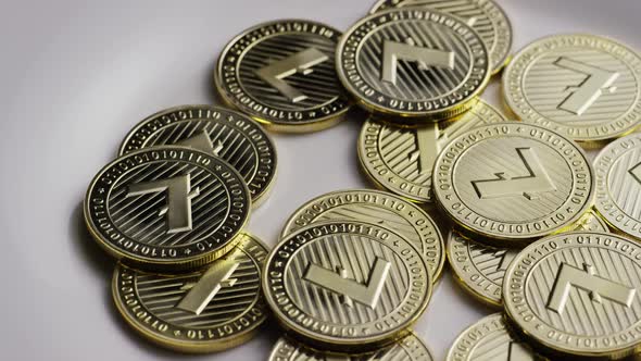 Rotating shot of Litecoin Bitcoins (digital cryptocurrency) - BITCOIN LITECOIN