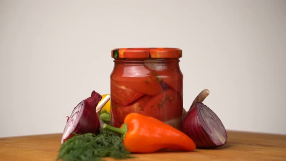 Footage Glass Jars with Salted Vegetables for the Winter Rotated on Table.