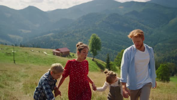 Positive Family Fooling Nature Coming on Top Hill