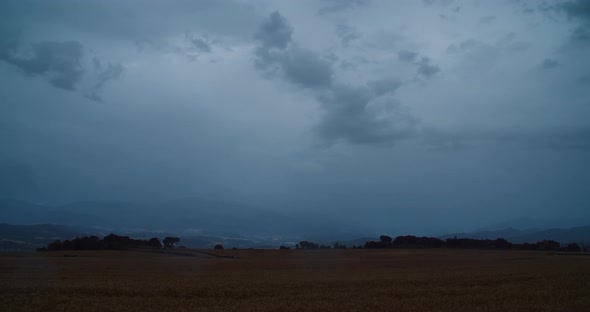 Timelapse on Countryside with Storm Clouds on Sky and Rain Drops on Lens