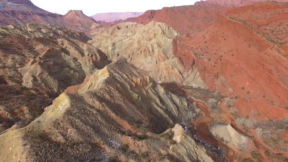 Flying over the desert landscape dirt layers in Onion Creek