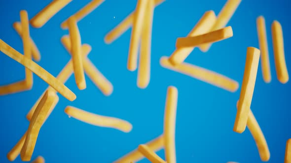 Endless animation of falling french fries. Chips. Slow motion. Blue background.