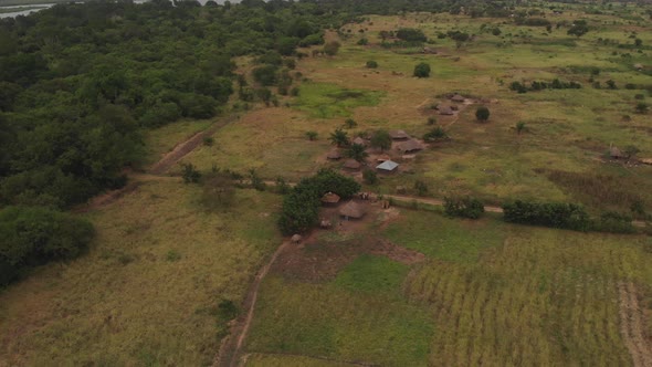 Aerial drone shot of a traditional, small and poor village in the middle of a nature landscape in Af