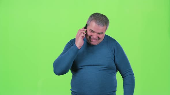 Man Is Talking on the Phone and Screaming. Green Screen