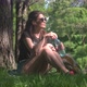 Young Woman Drinking Water From Bottle In Park - VideoHive Item for Sale