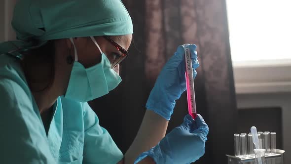 Doctor holding a coronavirus COVID-19 test tube