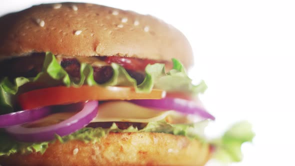 Big and Tasty Burger is Rotating on the Plate