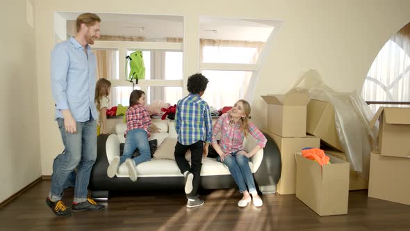 Happy Family Sitting on Couch