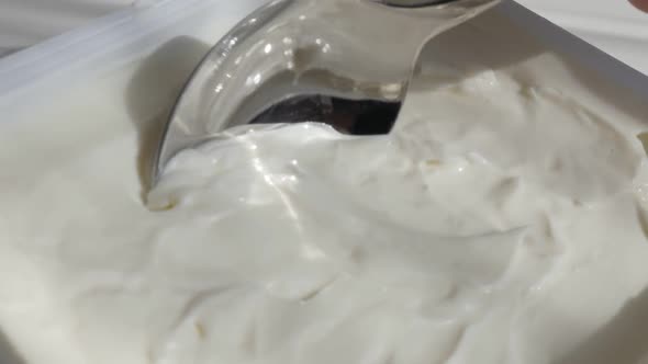 Cream cheese taking with metallic  spoon slow motion video