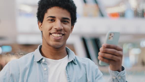 African American Guy Satisfied Happy Positive Man with Mobile Phone Showing Ok Sign Okay Gesture