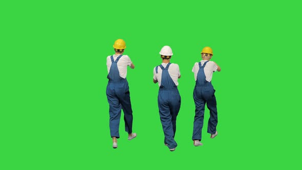 Three Male Construction Workers in Hard Hats Synch Dancing with Their Backs To the Camera