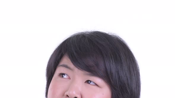 Eyes of Happy Overweight Asian Woman Thinking and Looking Up