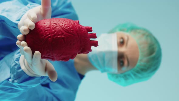 Vertical Video Surgeon Preparing for Complicated Heart Disease Related Procedure By Holding