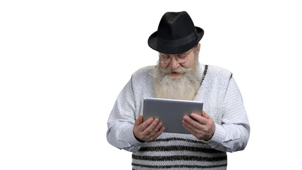 Grandfather Talking with Relatives Via Digital Tablet