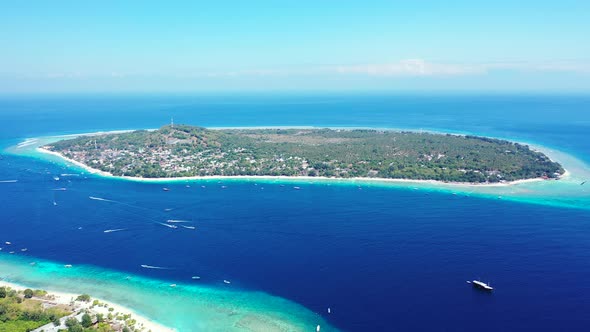 Wide angle above tourism shot of a paradise sunny white sand beach and blue ocean background in colo