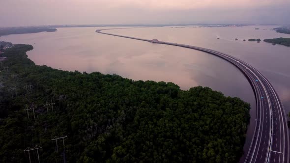 2.7K Bali Highway Miracle Sunset Ocean Aerial
