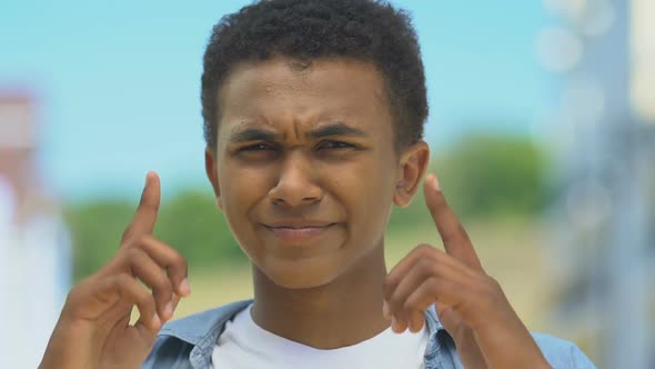 Boy Closing Ears, Gesturing No, Disobedient Teenager