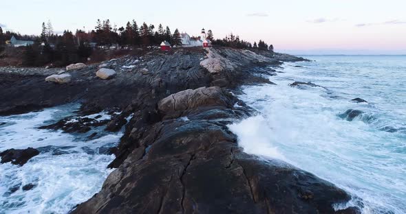 Aerial view from the sea to land highlighting the Grindel Point Light Islesboro Maine USA